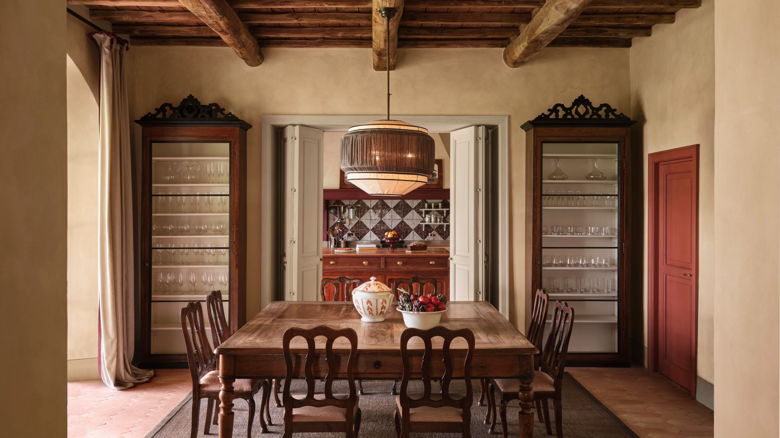Rustic dining room with a large wooden table  and a pendant light